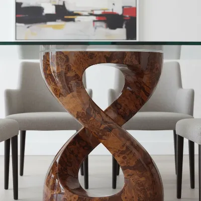 Elegant CB2 Aqua Virgo Burl Wood Dining Table showcasing its unique continuous leg design and rich wood grain in a modern dining room setting.